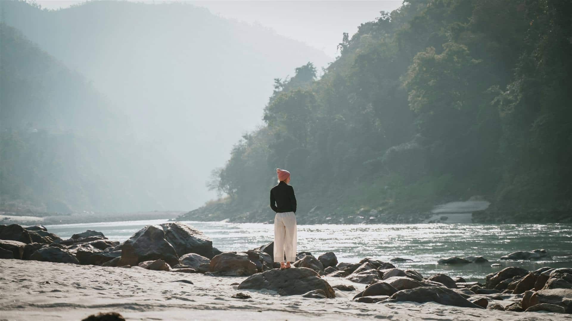 The Ganga running between forested Himalayan foothills at Rishikesh, seen from above