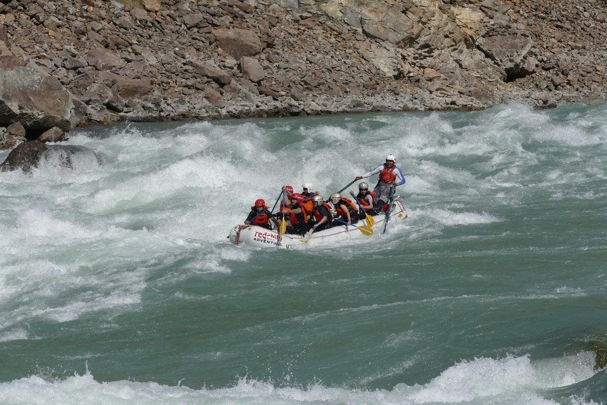 Rafters hitting a wave on the Ganga near Rishikesh