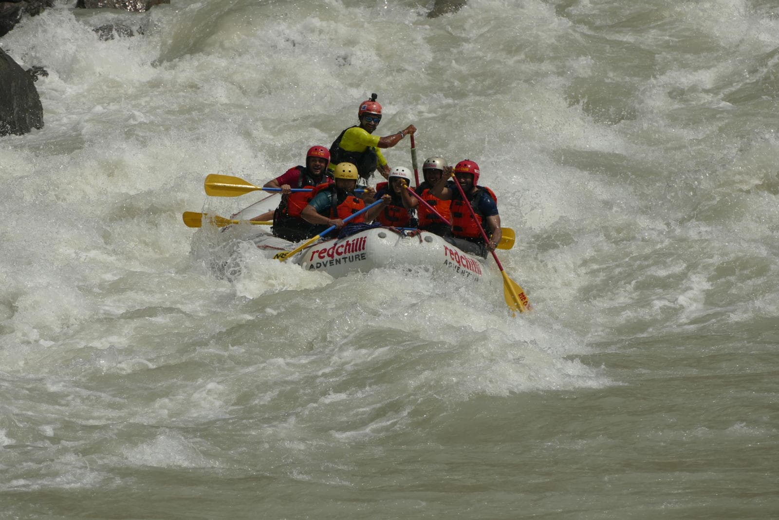 A raft crashing through a rapid on the Ganga near Rishikesh