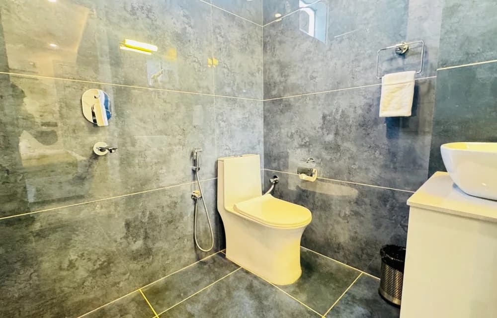 En-suite bathroom for the Deluxe Room with Garden View at Arista Haven, Tapovan, Rishikesh