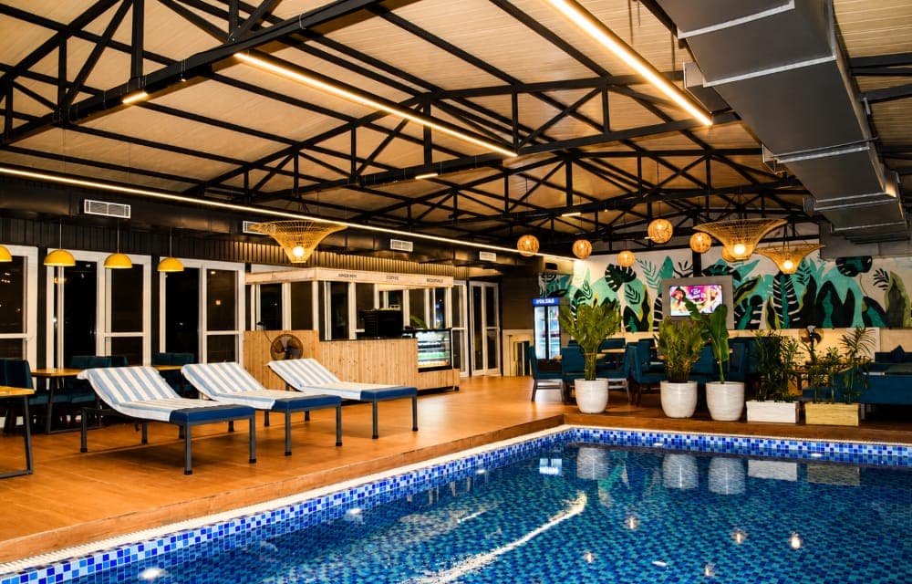 Loungers by the rooftop swimming pool at Arista Haven, Tapovan, Rishikesh