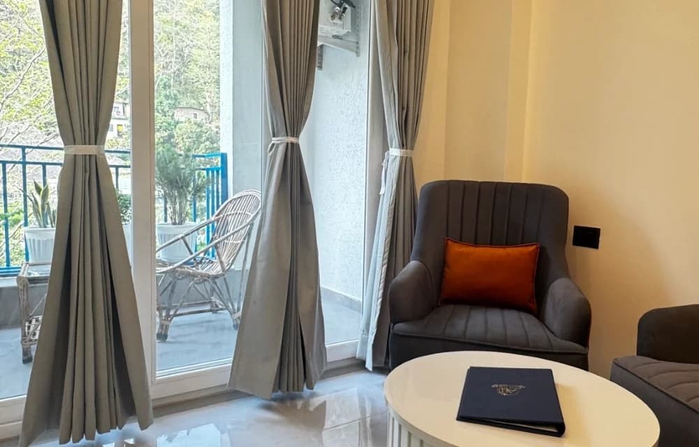 Close view of the private balcony seating for the Superior Room with Balcony at Arista Haven, Tapovan, Rishikesh