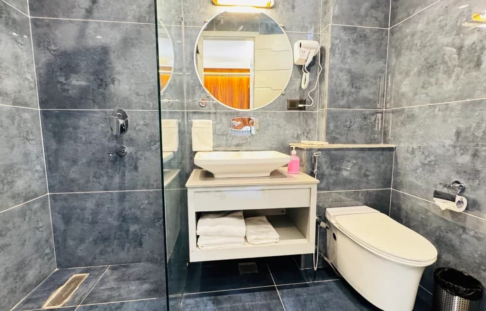 En-suite bathroom for the Superior Room with Balcony at Arista Haven, Tapovan, Rishikesh