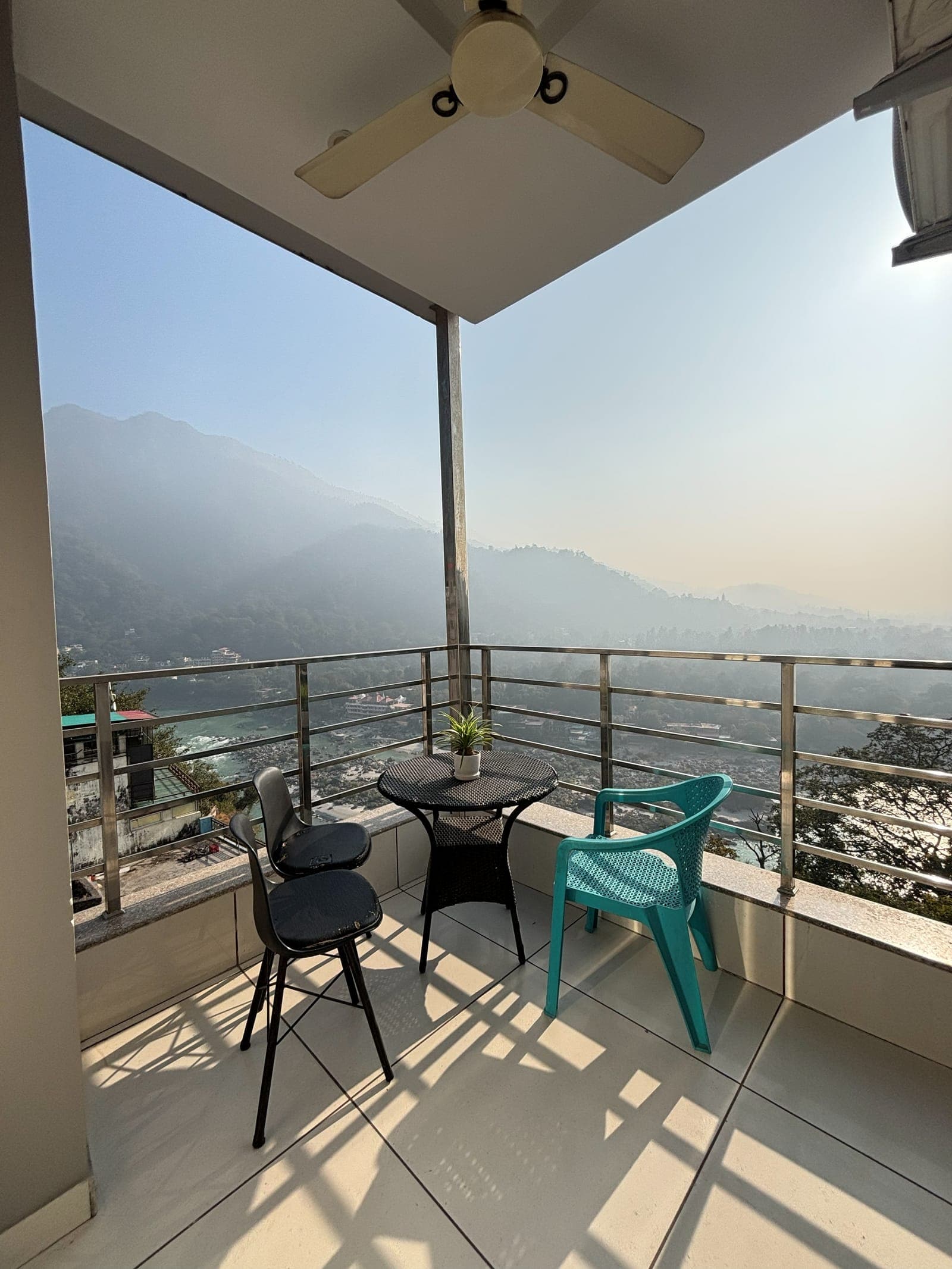 The Ganga-view balcony of the Executive Room at Aroma Cafe Hotel, Rishikesh