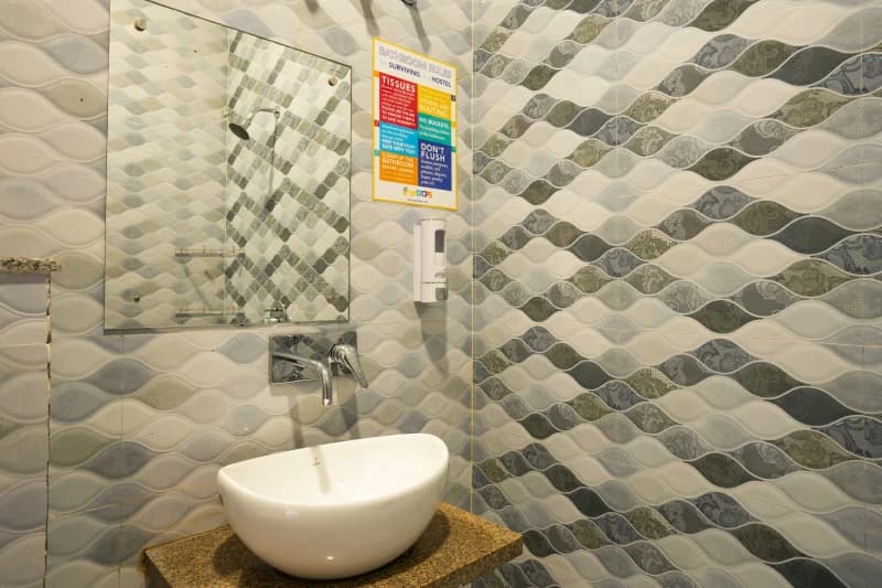 En-suite bathroom for the AC 4-Bed Mixed Dorm — Ensuite at goSTOPS Rishikesh, Lakshman Jhula