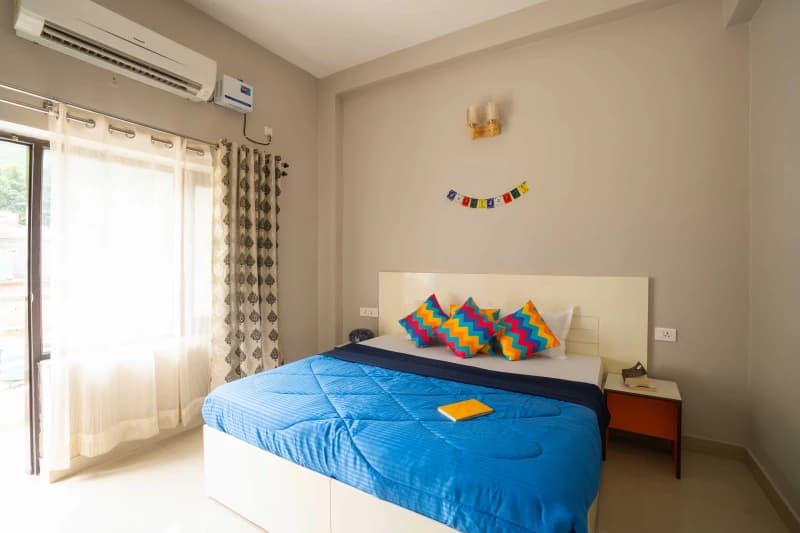 Inside the Deluxe Private AC Room — Ensuite at goSTOPS Rishikesh, Lakshman Jhula