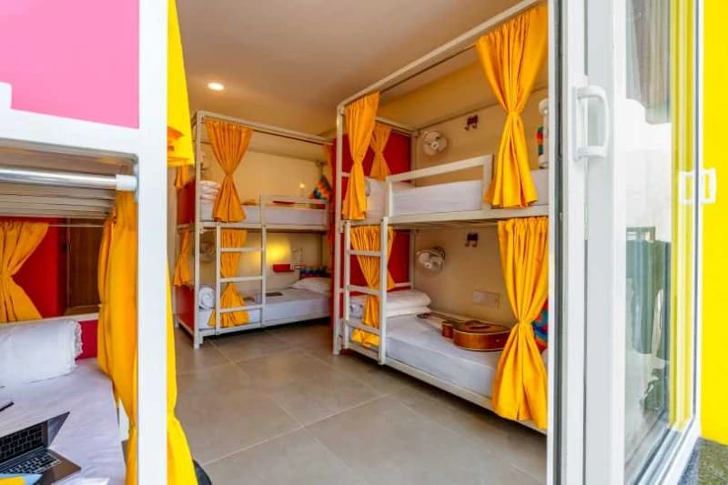 Inside the AC 6-Bed Female Dorm — Balcony, Ensuite at goSTOPS Rishikesh, Tapovan PLUS