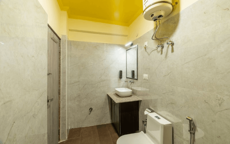 En-suite bathroom for the AC 8-Bed Mixed Dorm at The Hosteller Rishikesh, Ganges