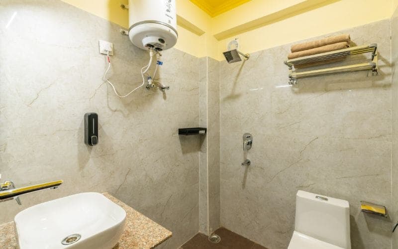 En-suite bathroom for the Deluxe Double Room (AC) at The Hosteller Rishikesh, Ganges
