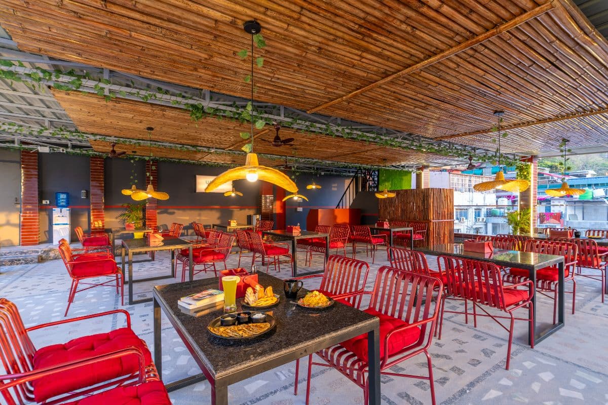 Café seating area at The Hosteller Rishikesh, Ganges