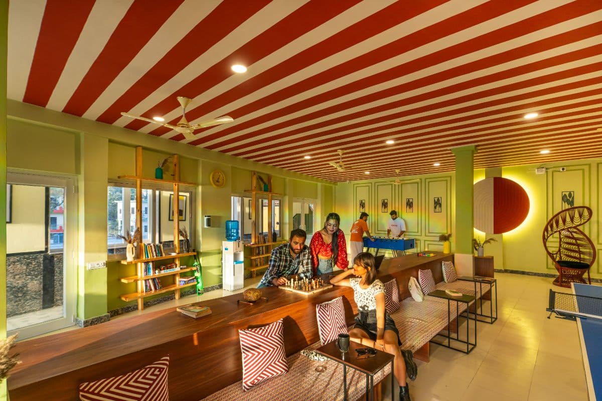 Common lounge and games area at The Hosteller Rishikesh, Ganges