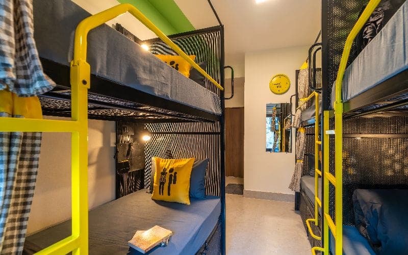 Inside the 4-Bed Mixed Dorm (Balcony, Hill View, AC) at The Hosteller Rishikesh, Laxman Jhula