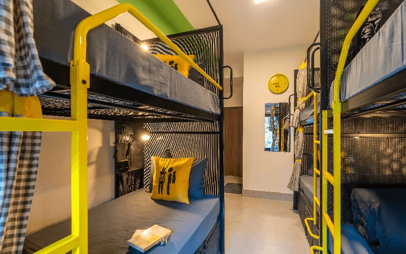 Inside the AC 4-Bed Mixed Dorm — Balcony, Hill View at The Hosteller Rishikesh, Laxman Jhula