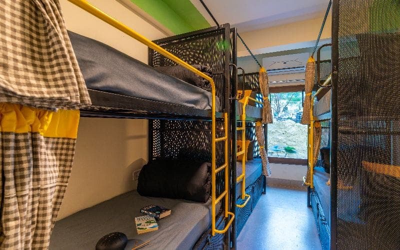 Inside the 4-Bed Mixed Dorm (Balcony, Hill View, AC) at The Hosteller Rishikesh, Laxman Jhula
