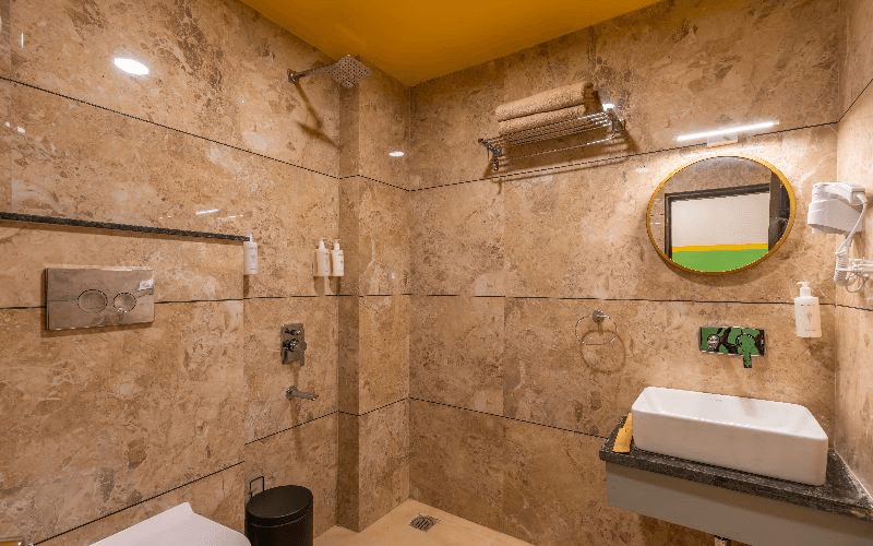 En-suite bathroom for the AC Deluxe Double Room — River View at The Hosteller Rishikesh, Laxman Jhula