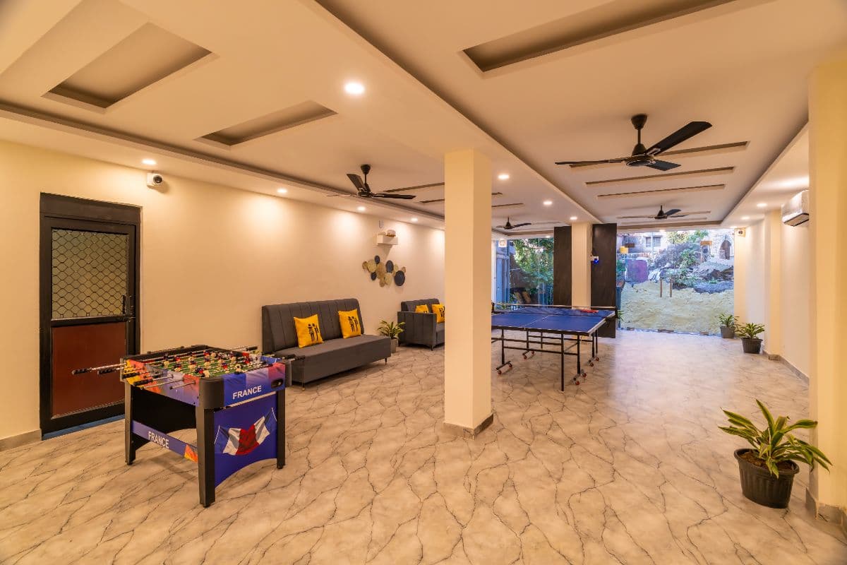 Indoor games room with foosball and table tennis at The Hosteller Rishikesh, Laxman Jhula