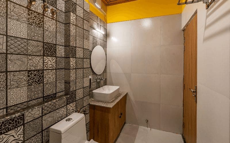 En-suite bathroom for the 12-Bed Mixed Dorm (AC) at The Hosteller Rishikesh, Upper Tapovan