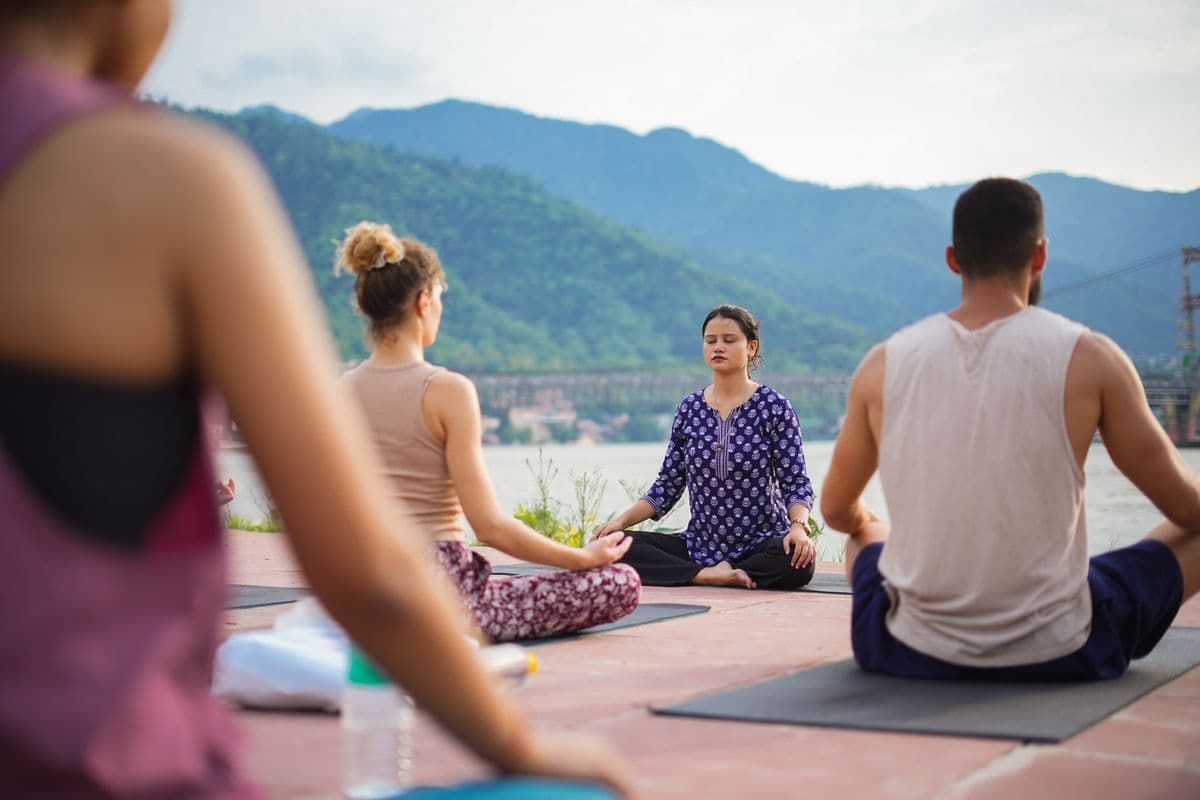 Morning yoga practice beside the Ganga in Rishikesh