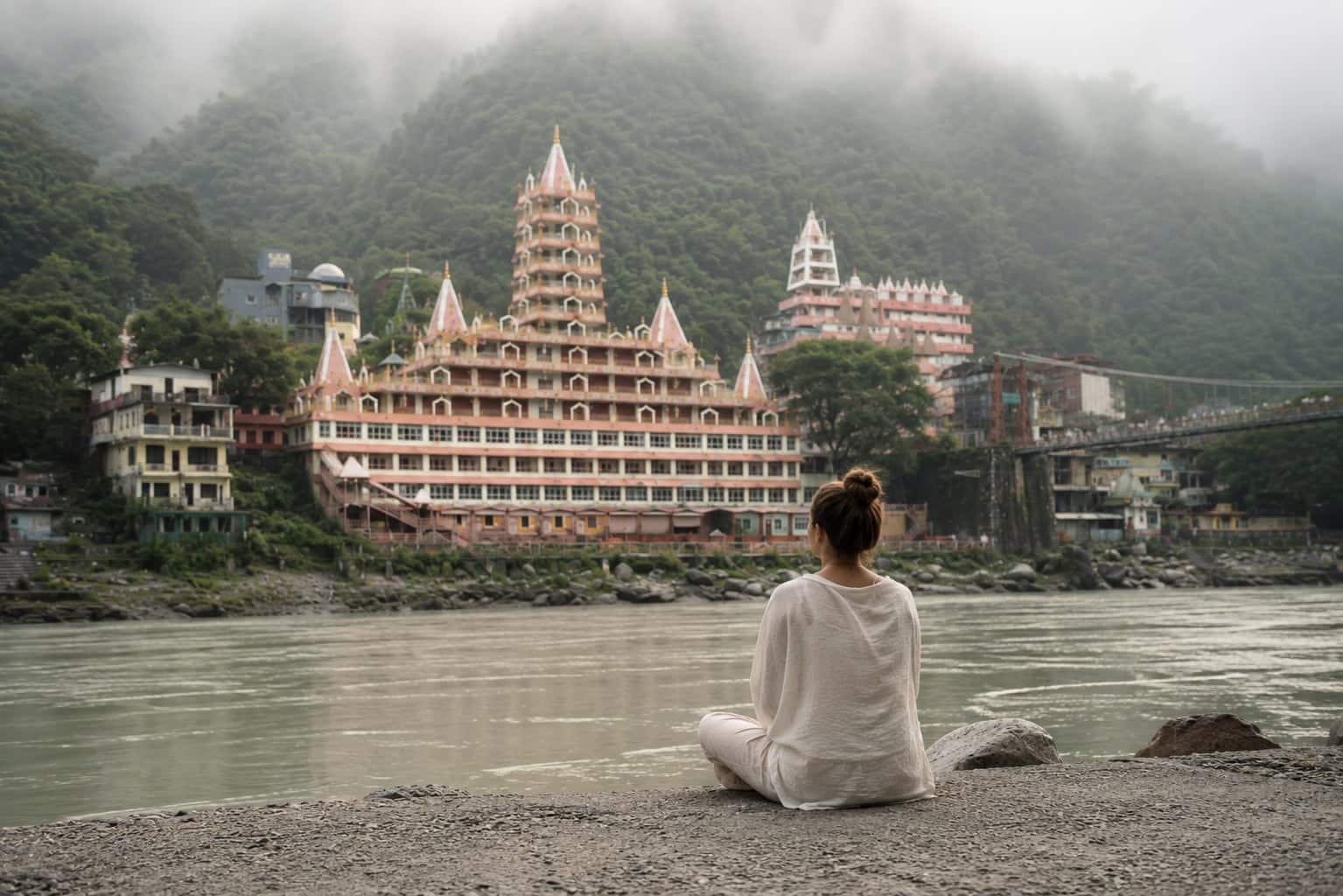 Someone sitting alone and still on the bank of the Ganga at Laxman Jhula