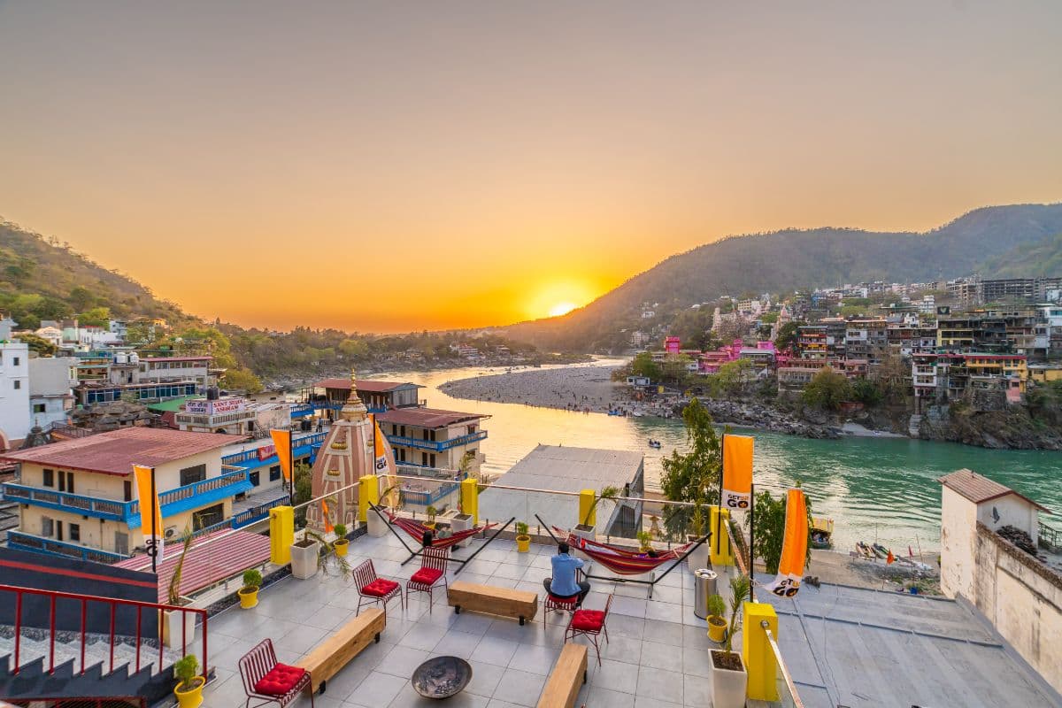 Rooftop terrace at sunset over the Ganga at The Hosteller Rishikesh, Ganges
